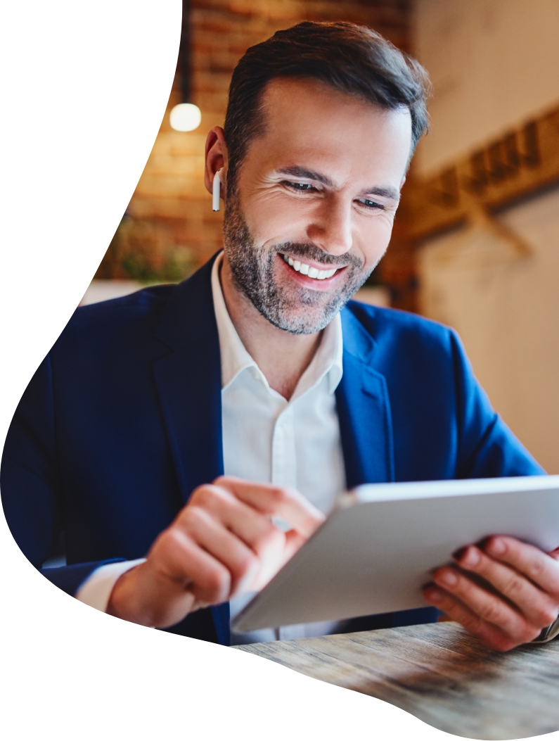 Man using headphones working on a tablet