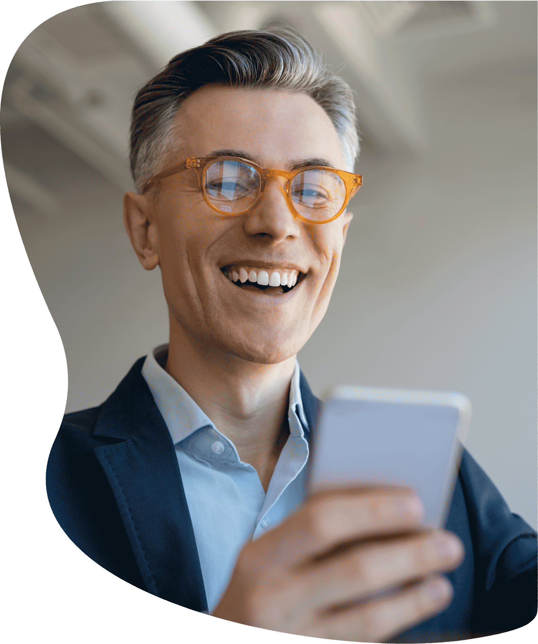 Man looking at a phone feeling happy